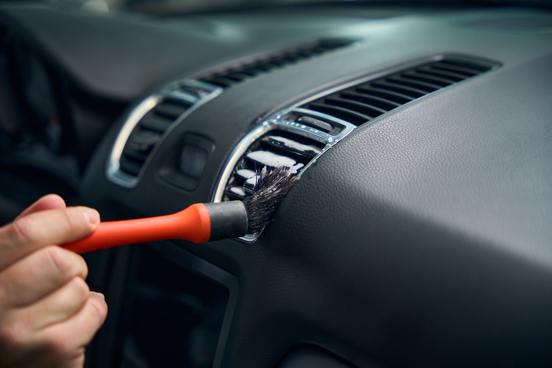 Male is detailing the car